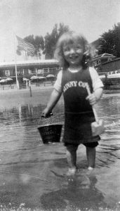 Alameda Post - child playing in water wearing Sunny Cove bathing costume