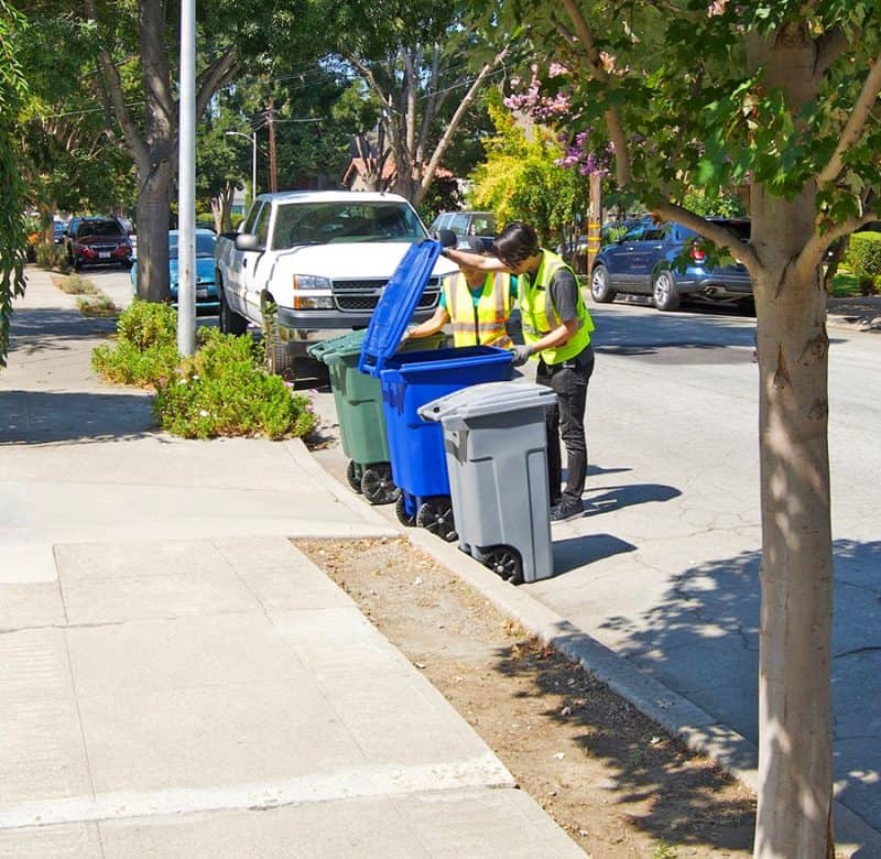 Alameda Post - Trash monitors checking bins