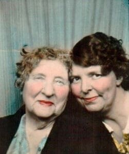 Alameda Post - an old photo of two women smiling at the camera