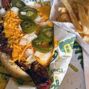 Alameda Post - a delicious-looking hotdog with choose, jalapeños, and more