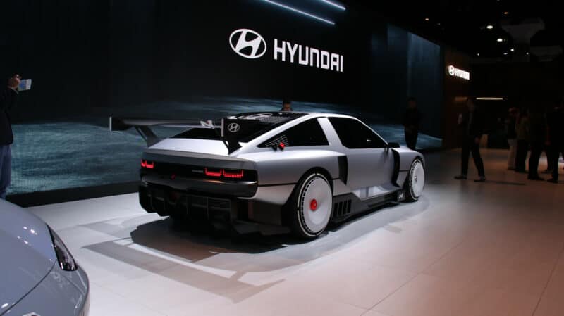 Alameda Post - a silver car on a stage at the LA Auto Show