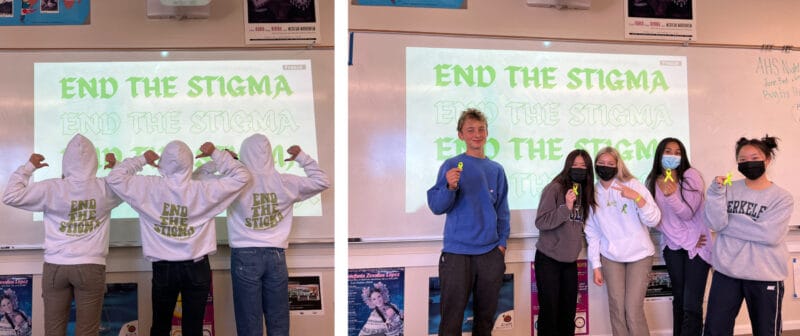 Alameda Post - two pictures in the same location at the front of a school classroom. A projected image on the whiteboard says "End the Stigma." In the left photo, three students wearing white and green hoodies are turned away from the camera and pointing to the back of their hoodies over their shoulders. The hoodies also say "End the Stigma." In the right photo, five students stand in the same place and smile at the camera. THey hold small bright yellow ribbons. 