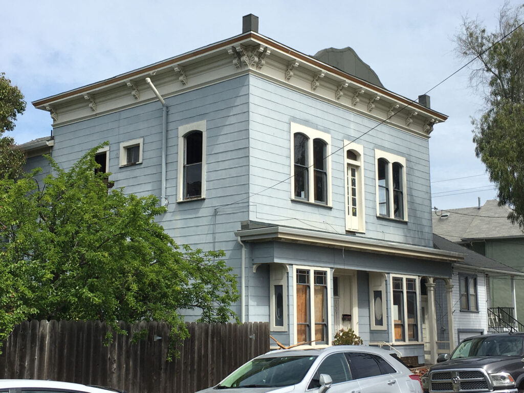 Alameda Post - a two story light blue house