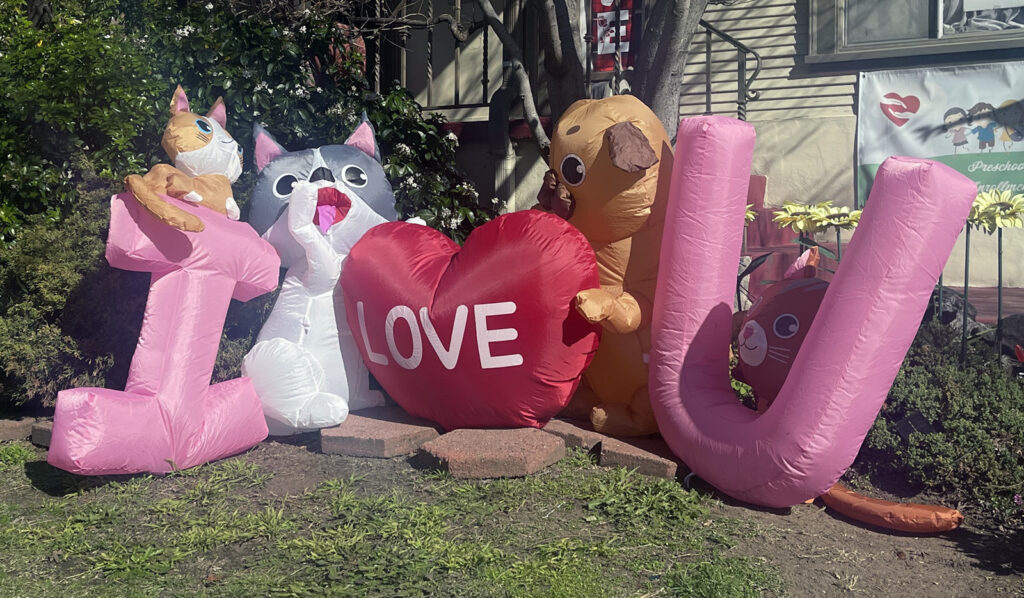 Alameda Post - Bear's-Eye View for February 12, 2023 – inflatables on a front lawn that spell out I love U