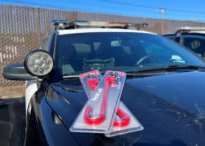 Alameda Post - a police car with locks in packages on the hood