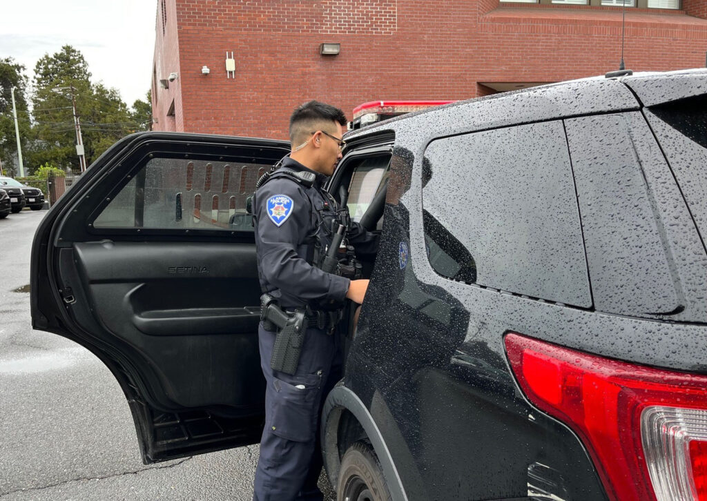 Alameda Post - an APD officer next to a vehicle that was subject to car theft