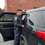 Alameda Post - an APD officer next to a vehicle that was subject to car theft
