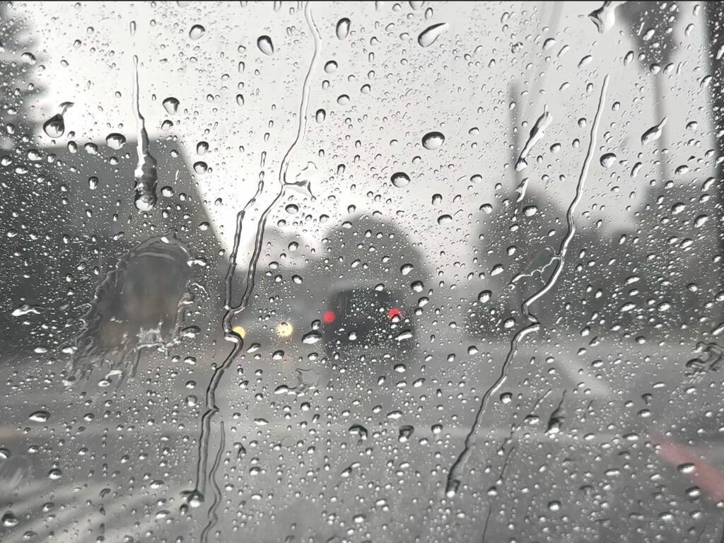 Alameda Post - Flood watch and wind advisory in effect. Photo shows a rainy scene through a rain-covered window