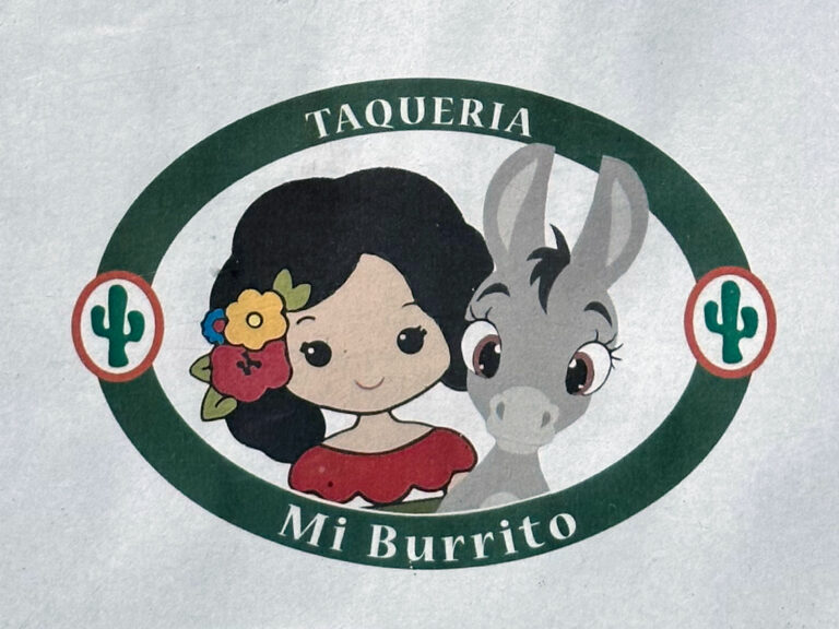 Alameda Post - Taqueria Mi Burrito logo, a caricature of a young woman with flowers in her hair standing with a young burro