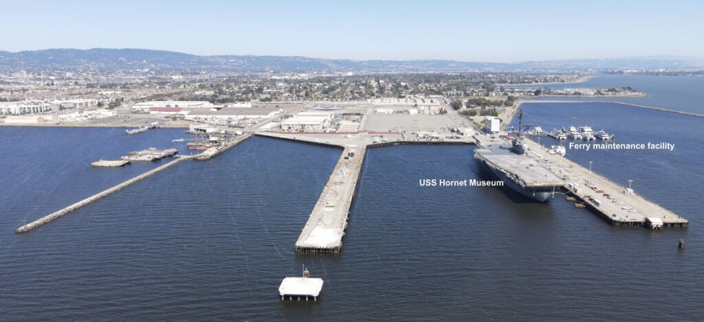 Alameda Post - an empty pier next to USS Hornet