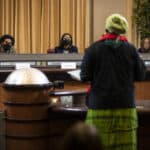 Alameda Post - Task Force members listen during the public comment portion of the AB 3121 Task Force to Study and Develop Reparations Proposals for African Americans meeting in Oakland on Dec. 14, 2022. Photo by Martin do Nascimento, CalMatters