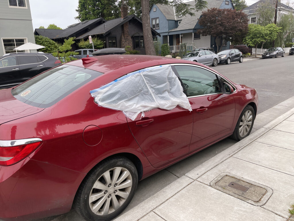 Alameda Post - Bear's-Eye View of Alameda for May 24, 2023 – a car with plastic covering a broken window