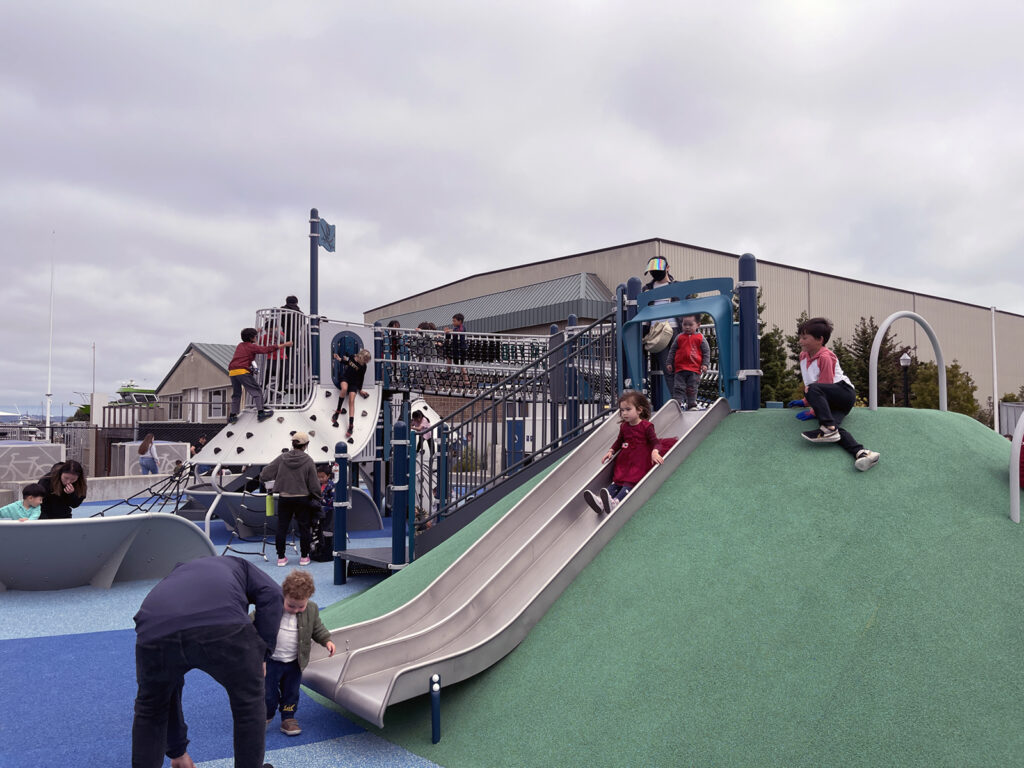 Alameda Post - Bear's-Eye View of Alameda for May 24, 2023 – kids playing on the playground of Bohol Circle Immigrant Park