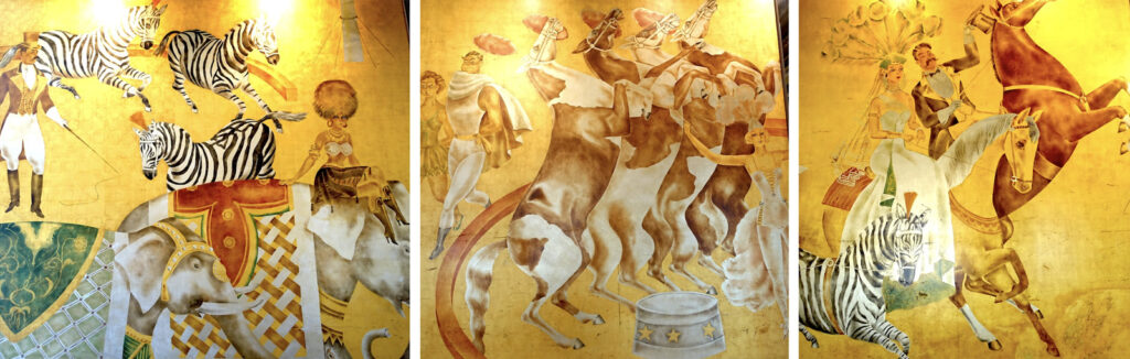 Alameda Post - sections of a mural on a bright gold background. The scenes depict a circus, including elephants, zebras, performers, and a ringmaster