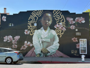 Alameda Post - a large mural of a young Korean girl