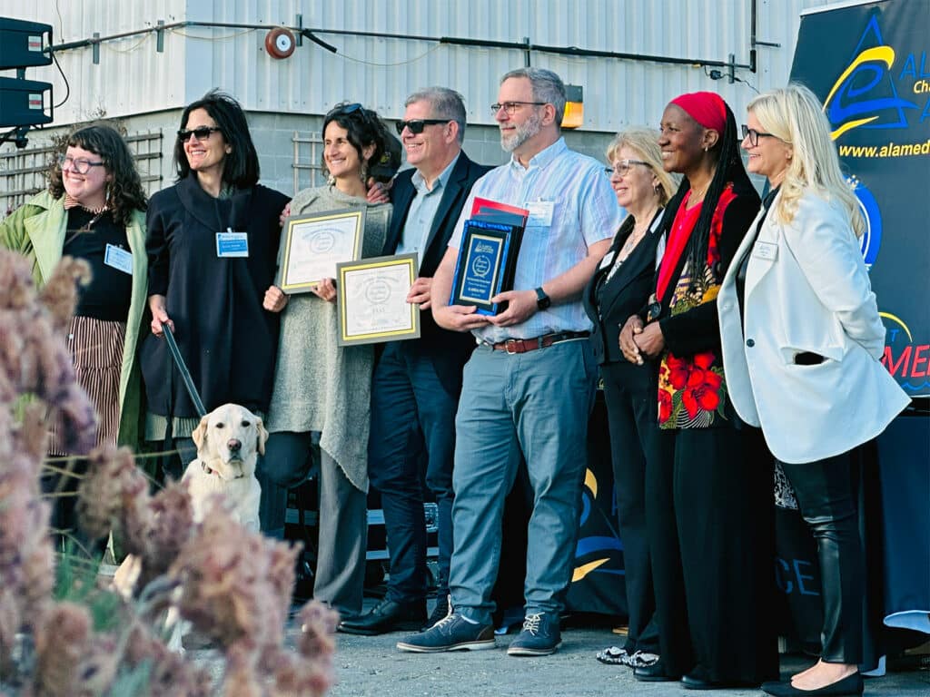 Alameda Post - winners and participants in the 2023 Business Excellence Awards stand and smile for a photo