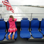 Alameda Post - A young girl rides the San Francisco Bay Ferry