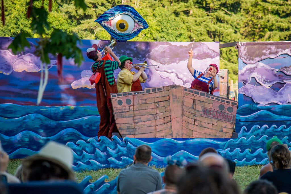 Alameda Post - Ship of Fools: A Giant Puppet Odyssey performance with actors in a boat on water