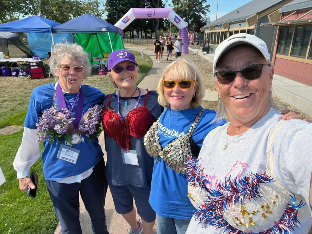 Alameda Post - In a walk dedicated to breast cancer research, Kiwanian women honored the event’s “Carnival” theme by wearing spangled bras. From left: Joanne Robinson, Denise Gasti, Donna Marie Ferro and Cheryl Saxton.