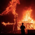 Alameda Post - A home burns as the Camp Fire rages through Paradise on Nov. 8, 2018. Photo by Noah Berger, AP
