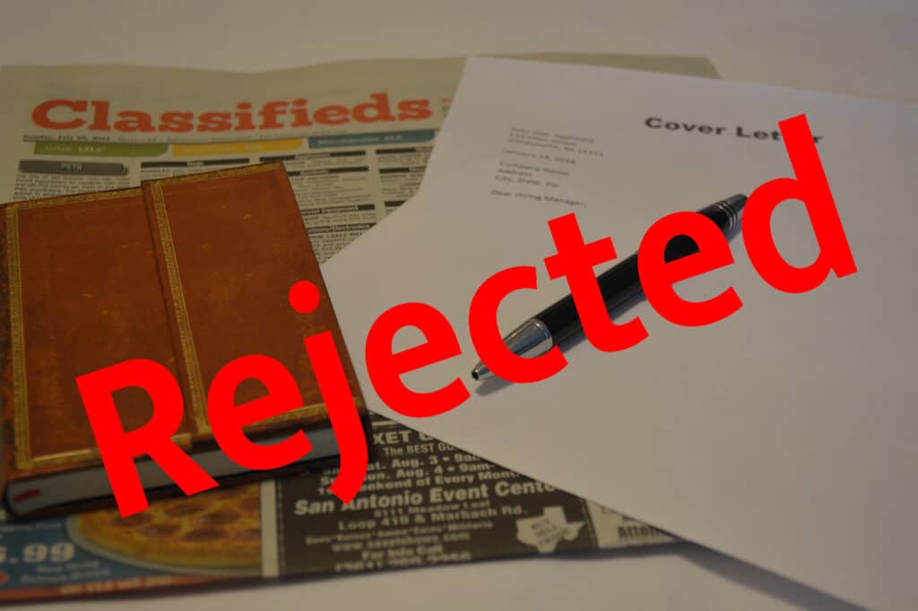 Alameda Post - a classified ads newspaper section, a notebook, and a cover letter with the word "Rejected" in big bold letters on the top