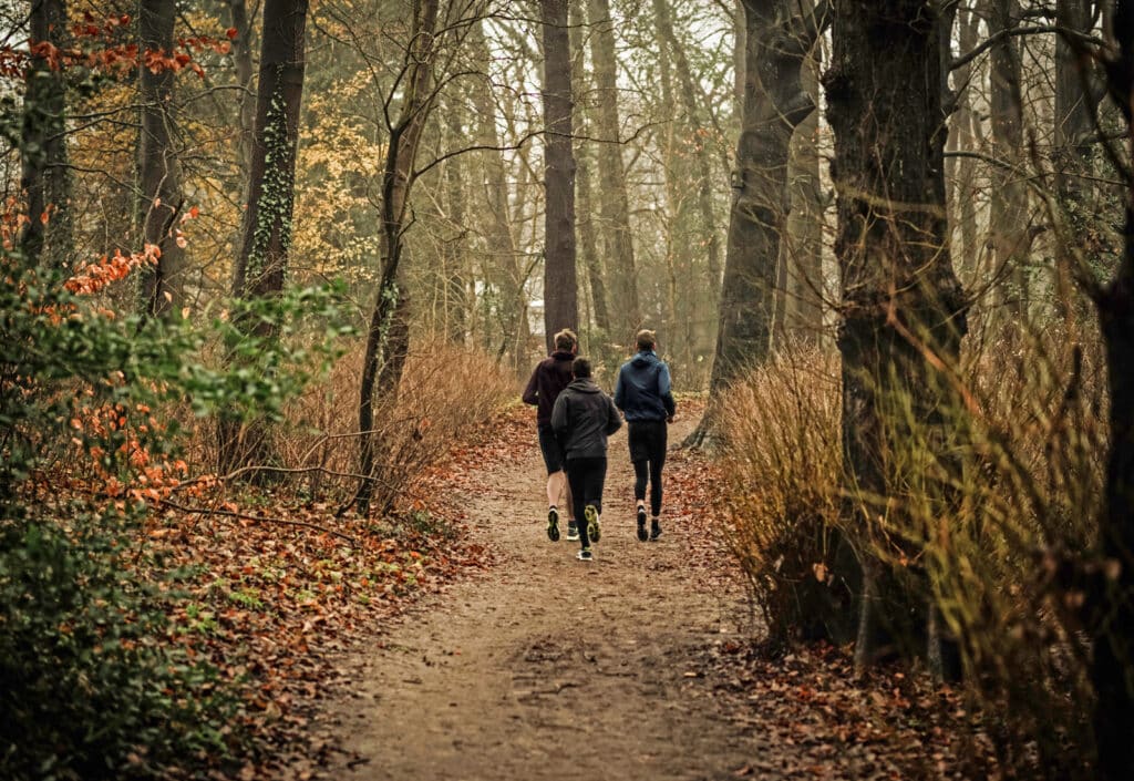 Alameda Post - teens run through the woods. Keep reading for local cross country races