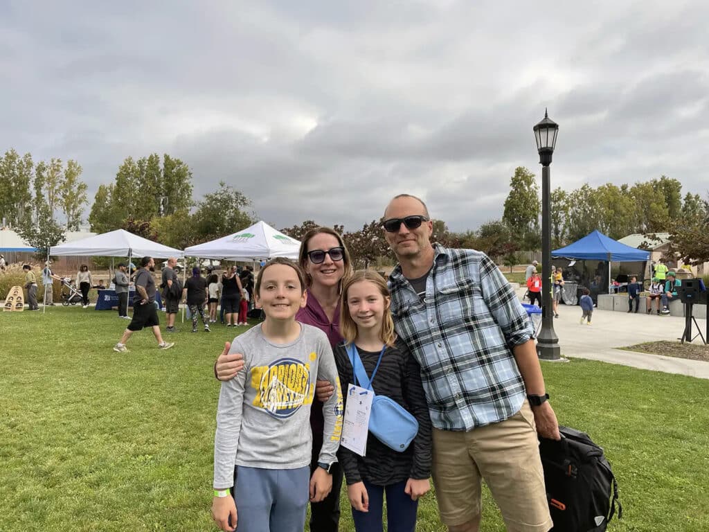 Alameda Post - a family of four in a group photo