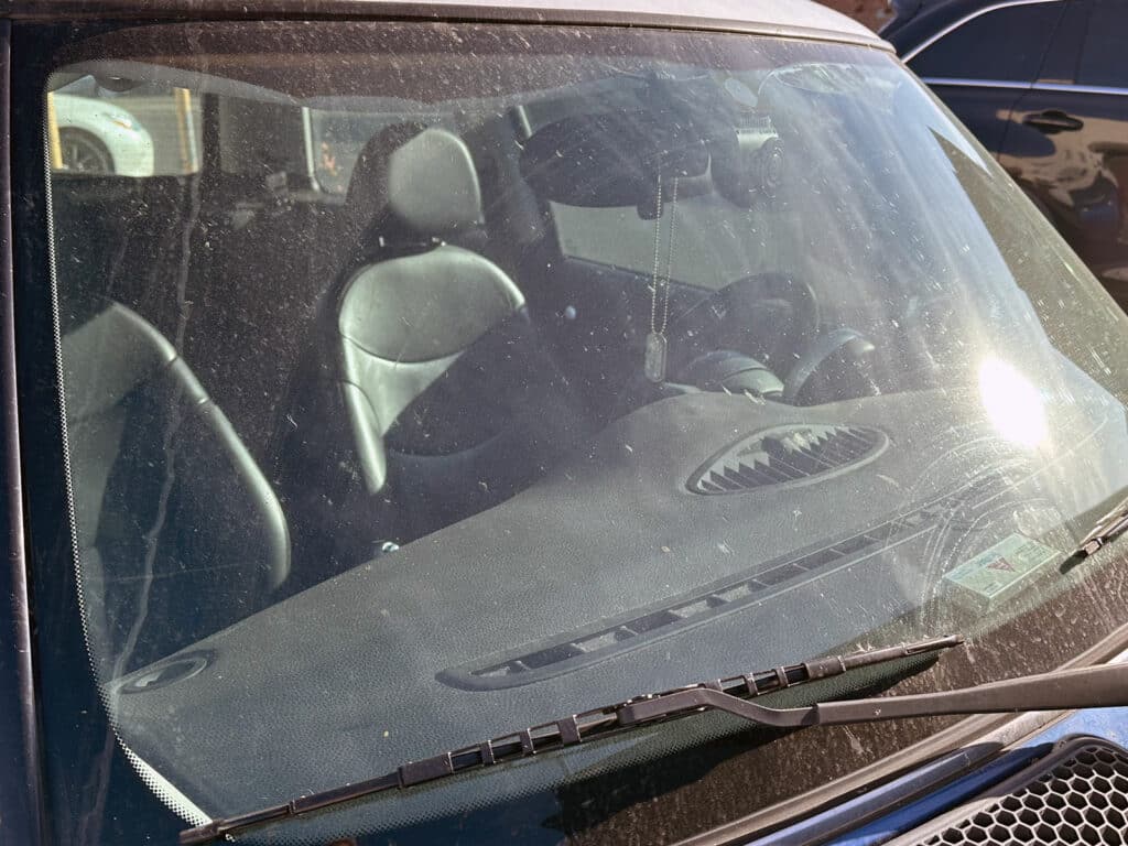 Alameda Post - a dirty windshield with sun glare 