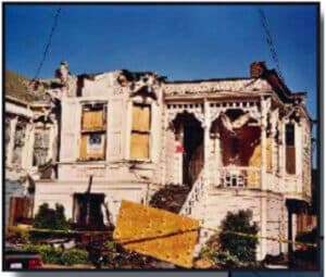 Alameda Post - a burned home. The roof is missing, and the house looks like it might not be fixable