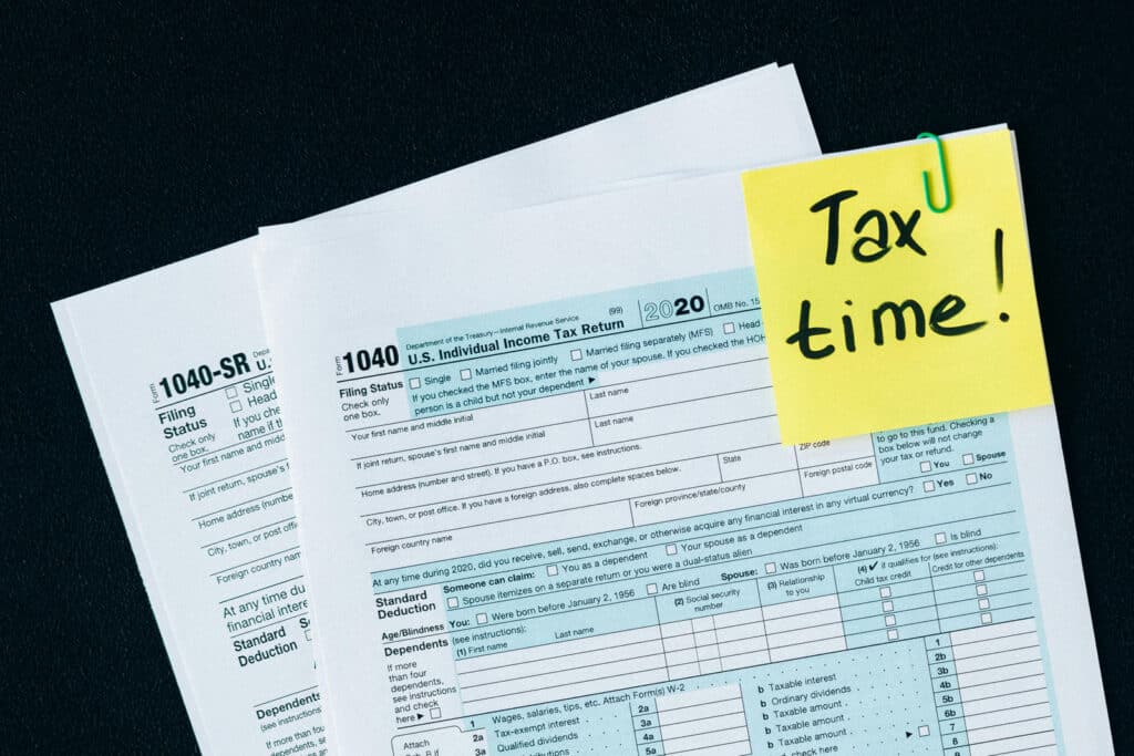 Alameda Post - a graphic with tax documents that says "Tax Time" on a sticky note