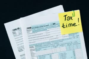 Alameda Post - a graphic with tax documents that says "Tax Time" on a sticky note