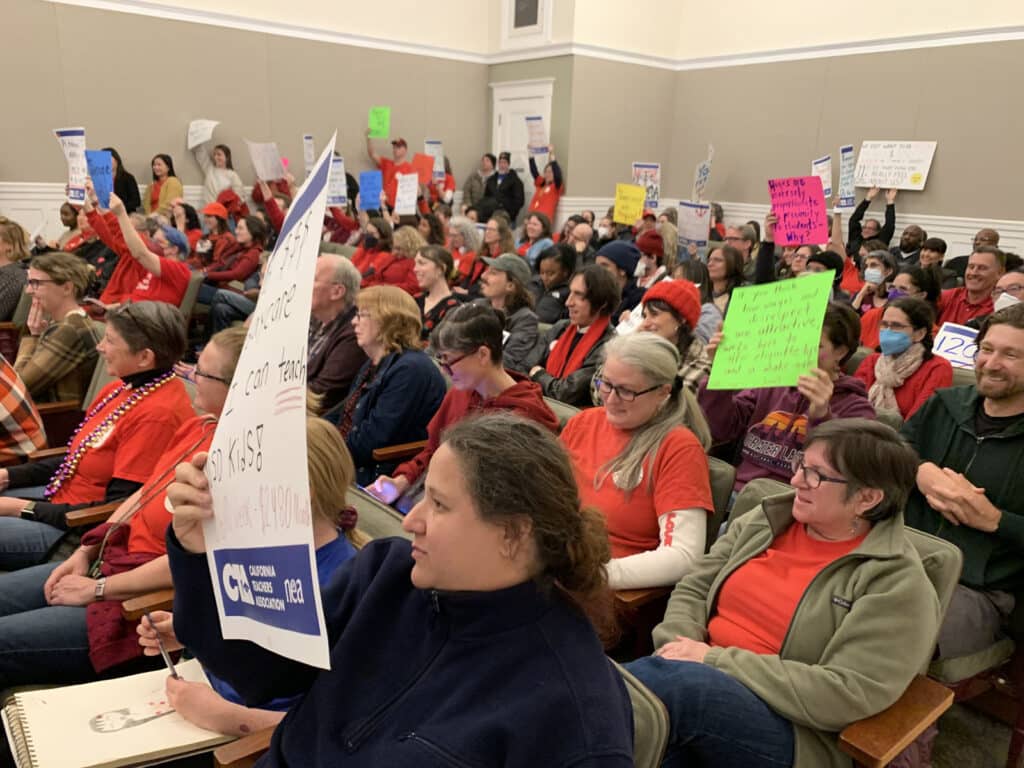 Alameda Post - a room full of teachers and staff wearing red
