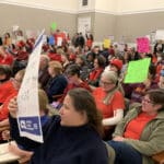 Alameda Post - a room full of teachers and staff wearing red