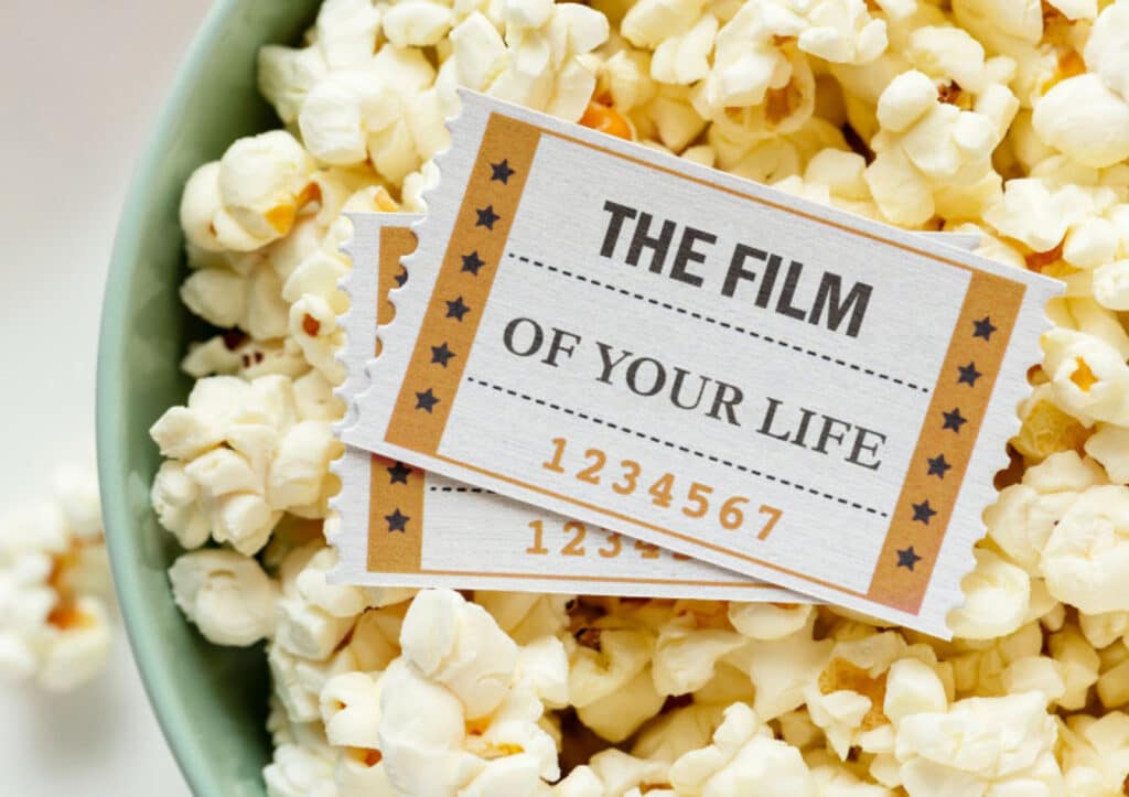 Alameda Post - a bowl of popcorn with tickets on top that say "The Film of your life 1234567"