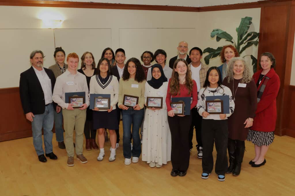 Alameda Post - the Kiwanis Hope of America award recipients smile with their awards. Others stand around then and smile