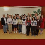 Alameda Post - the Kiwanis Hope of America award recipients smile with their awards. Others stand around then and smile