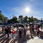 Alameda Post - Alameda Education Association dances in a circle outside City Hall