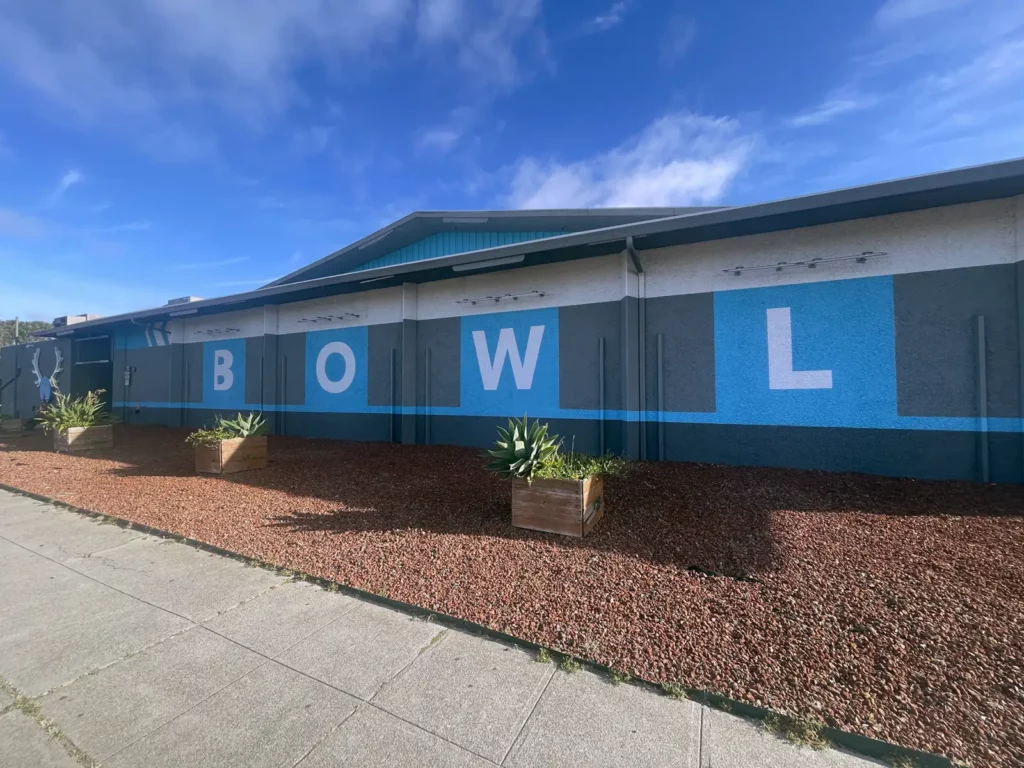 Alameda Post - Side of Bowlero bowling alley with the word 'bowl' painted on it