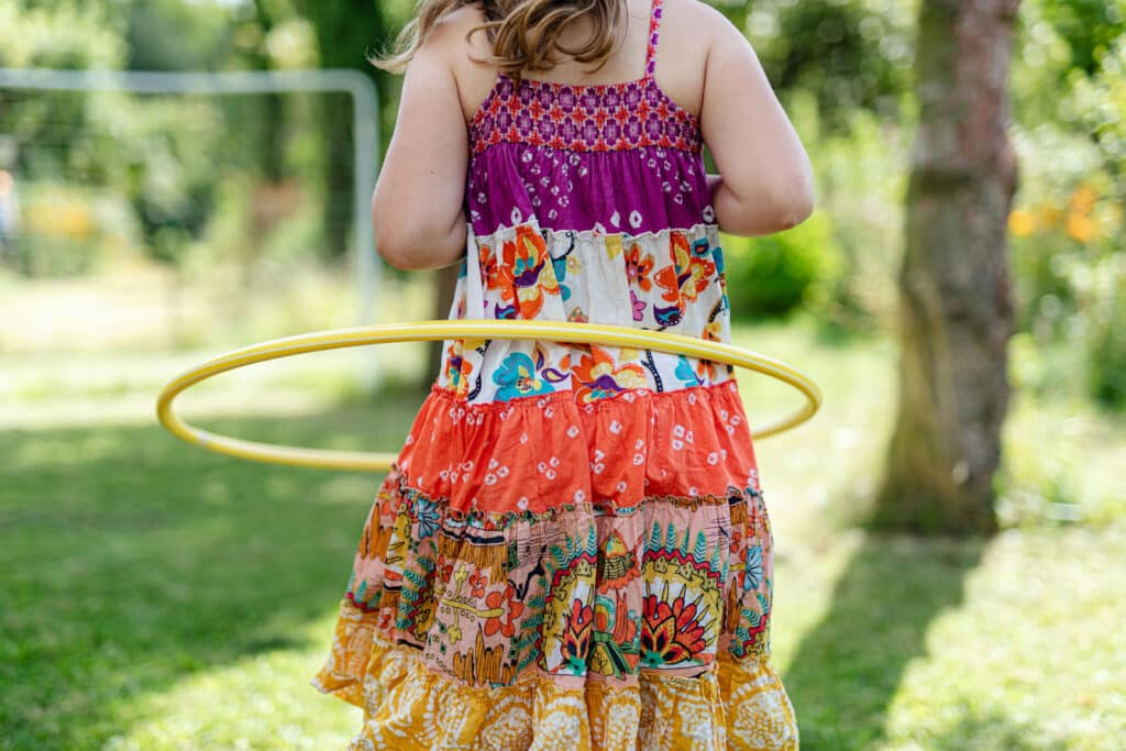 Alameda Post - a child plays with a hula hoop