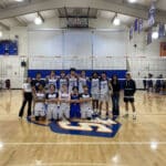 Alameda Post - the SJND Pilots volleyball team poses together on the court