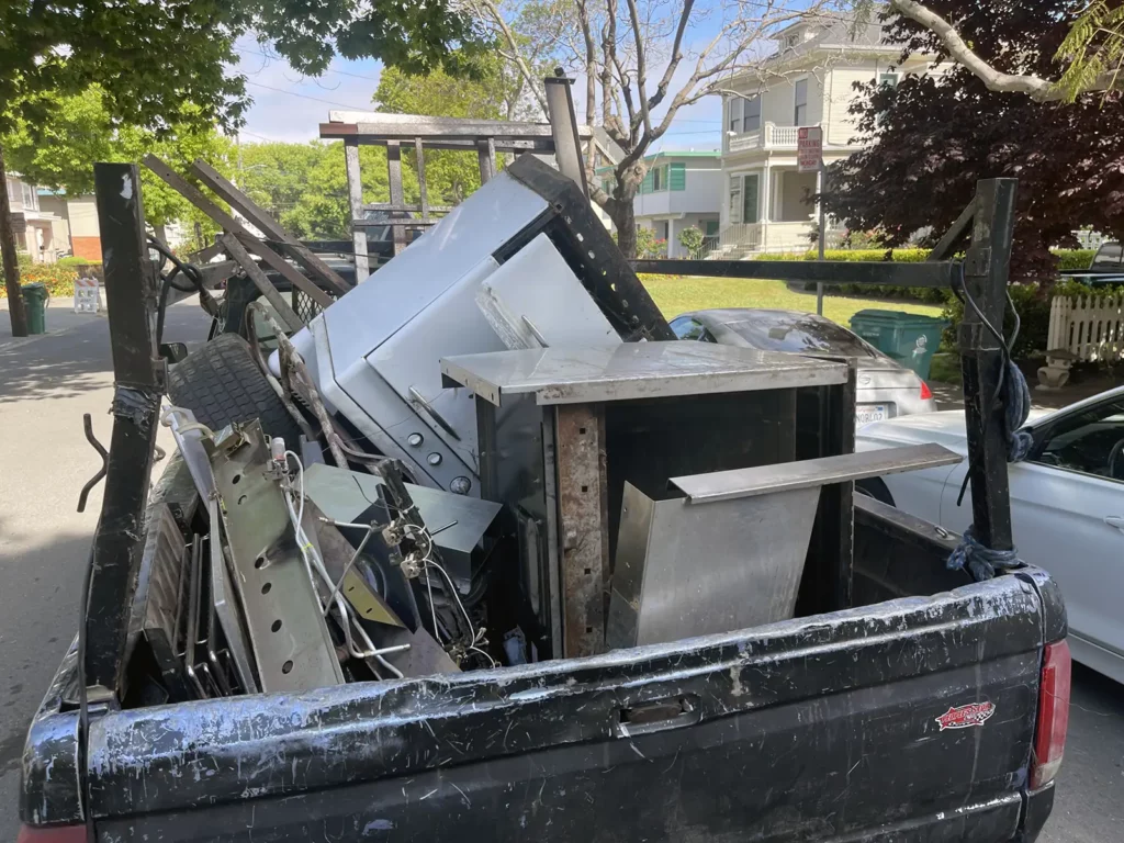 Alameda Post - The old stove being taken away for scrap metal