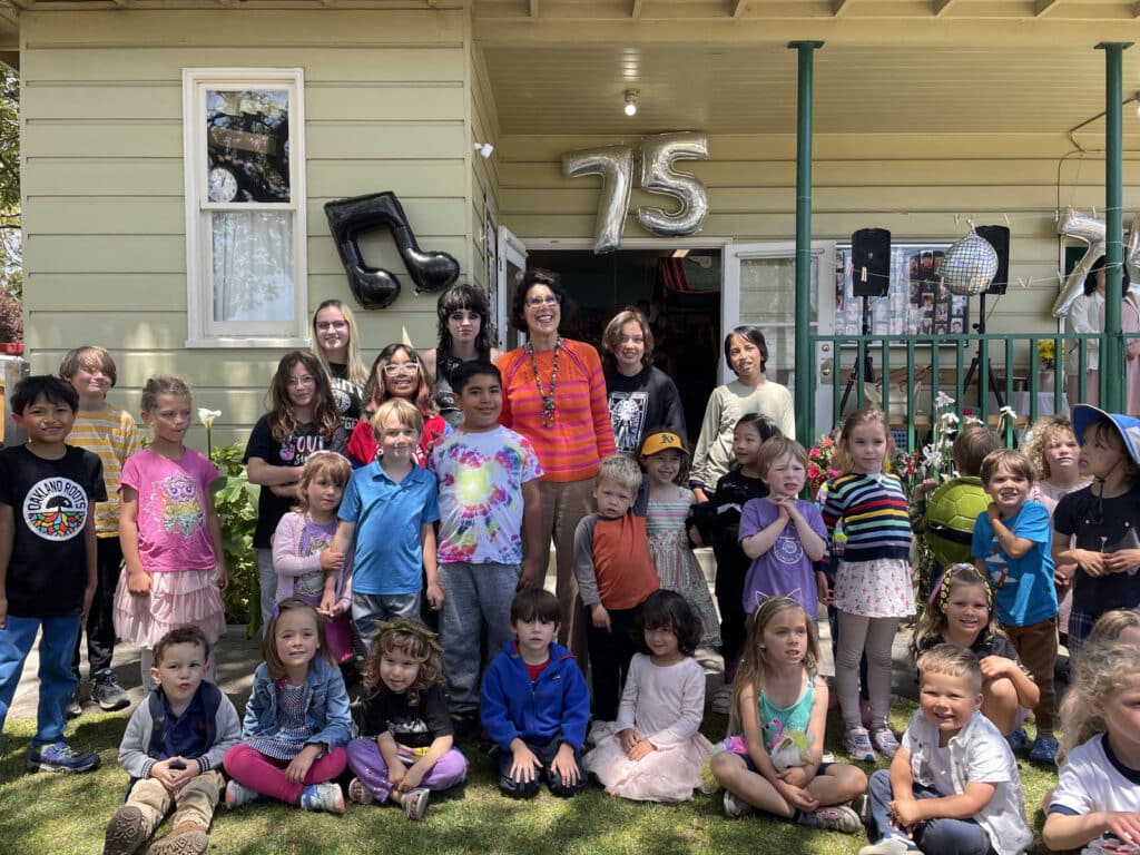 Alameda Post - Mayor Marilyn Ezzy Ashcraft surrounded by a large group of children of all ages who attended Kiddie Kampus