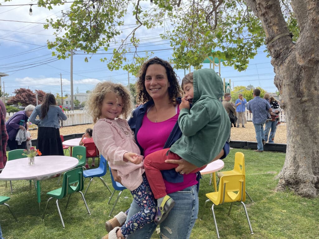 Alameda Post - a mother holds her two children
