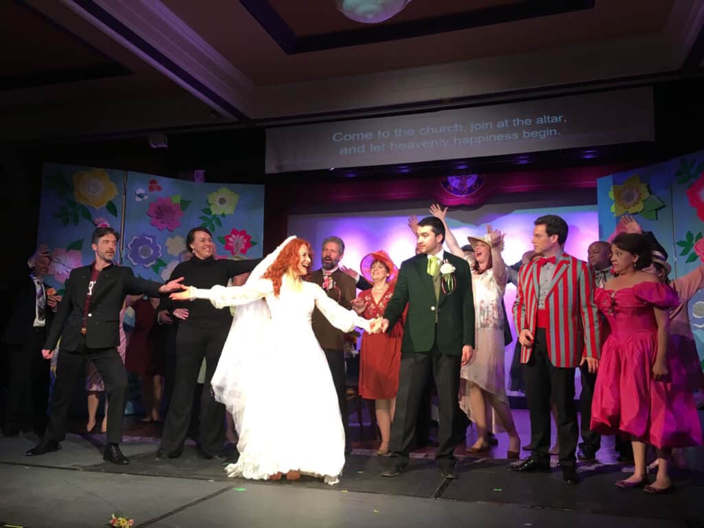 Alameda Post - Eileen Meredith wears a wedding dress onstage with a large cast