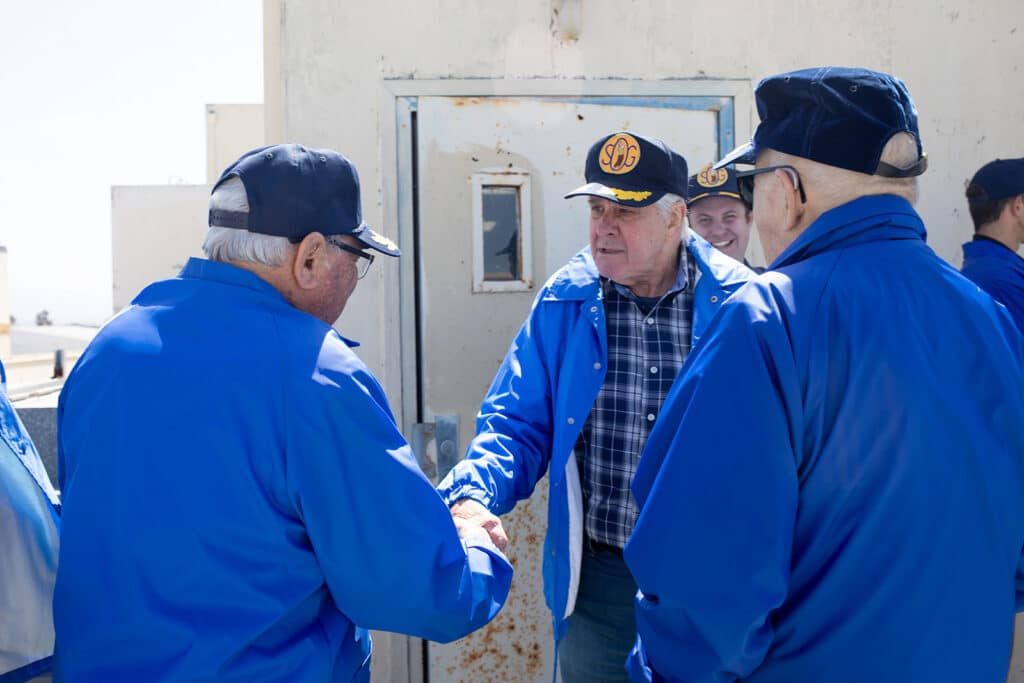 Alameda Post - Veterans shake hands. 