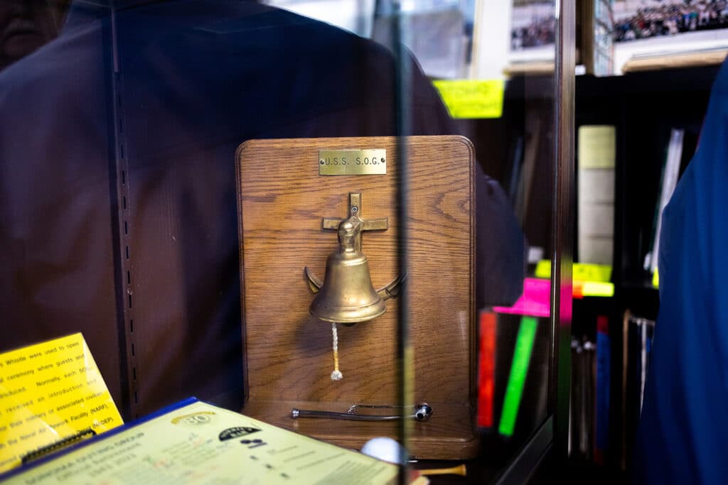 Alameda Post - a bell behind glass. 