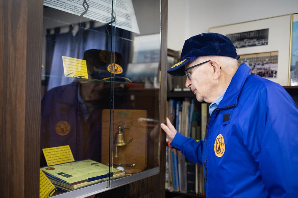 Alameda Post - A veteran looking into a glass case. 