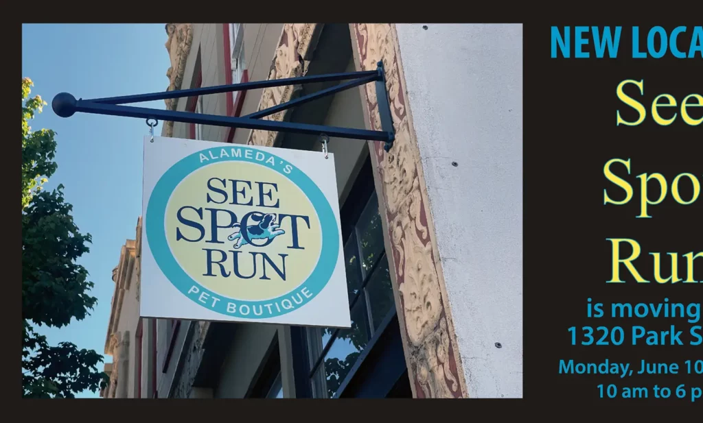 Alameda Post - a sign that says "See Spot Run" hanging outside a business