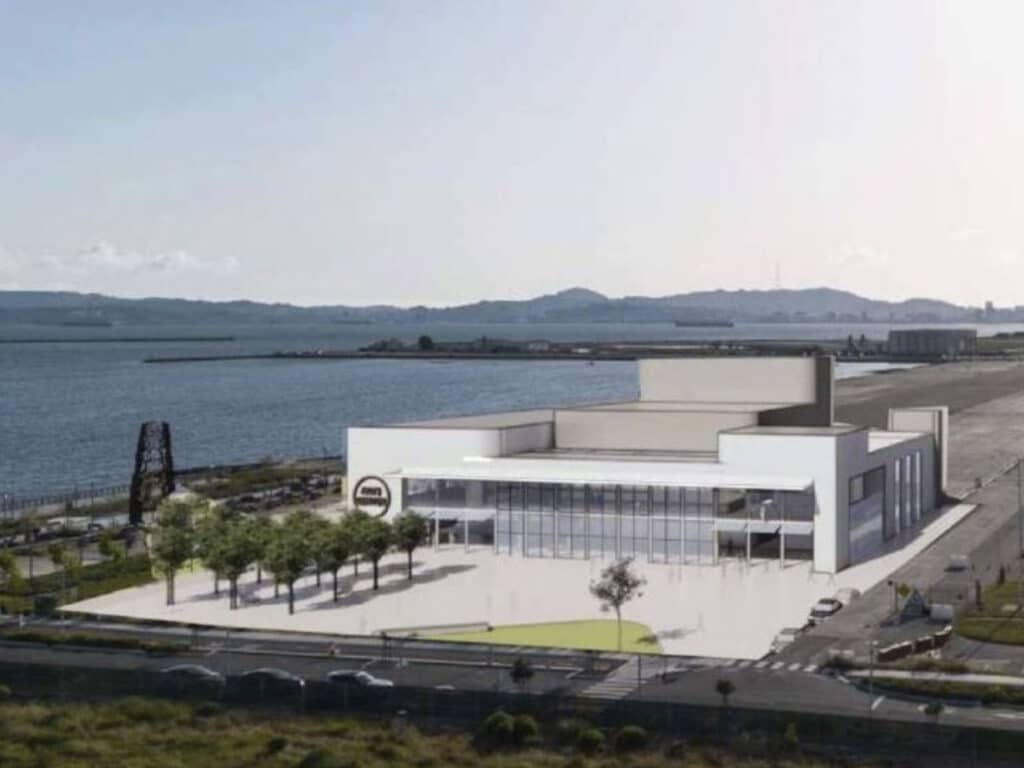 Alameda Post - a render of what the Performing Arts Center at Alameda Point could look like. It's a large, clean, modern-looking building with white walls and large windows