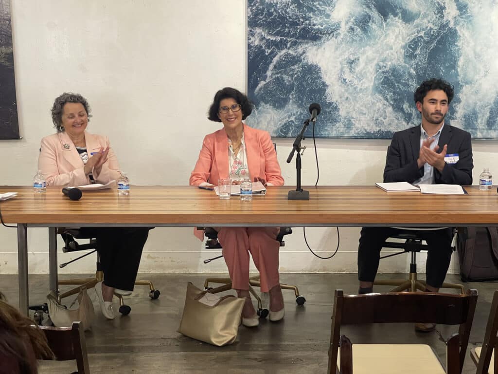 Alameda Post - panel members at the League of Women Voters of Alameda's Student Advisory Committee panel discussion. Three people sit behind a table. 